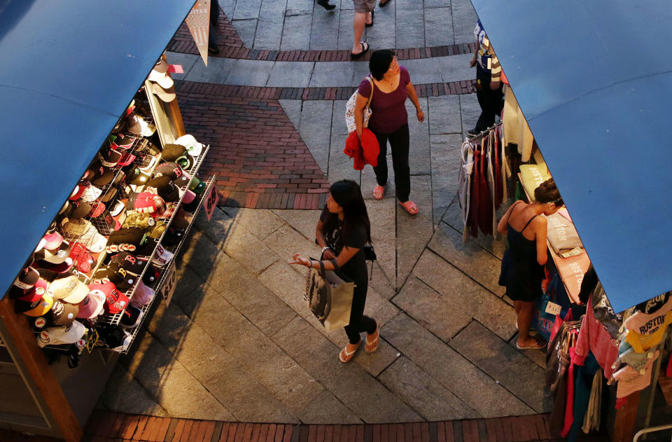 In this Tuesday, July 10, 2012, photo, shoppers look for merchandise in Boston. A private research group says that consumer confidence unexpectedly fell in August to the lowest level since November 2011, as Americans' outlook about jobs flared up. The New York-based Conference Board said Tuesday, Aug. 28, 2012, that its Consumer Confidence Index fell to 60.6, down from a revised 65.4 in July. Economists had expected a reading of 66. The index now stands at the lowest point since November 2011 when the reading was at 55.2. (AP Photo/Elise Amendola)