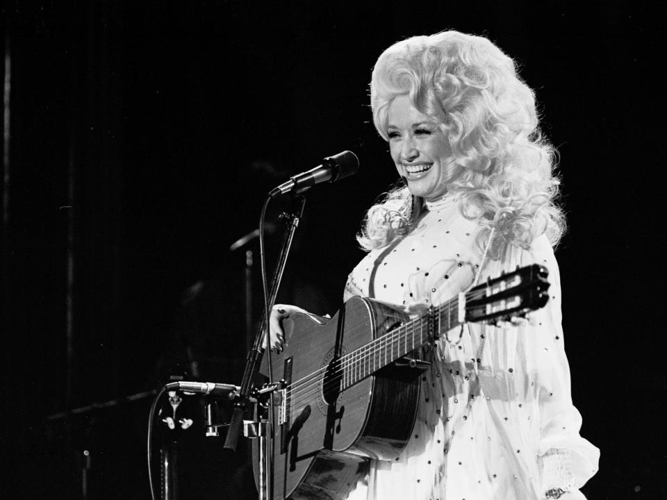 Dolly Parton circa 1970 performing onstage.