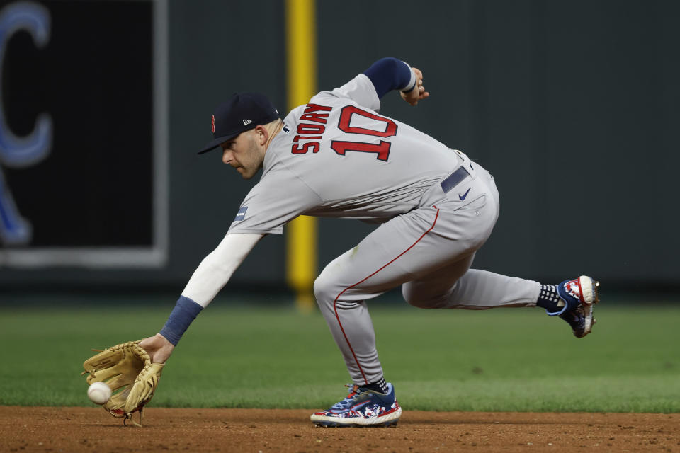 Boston Red Sox shortstop Trevor Story reaches for a ground ball from Kansas City Royals' Freddy Fermin, who was out at first during the third inning of a baseball game in Kansas City, Mo., Friday, Sept. 1, 2023. (AP Photo/Colin E. Braley)