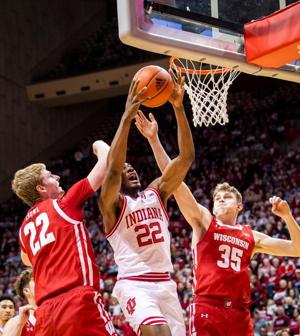 Indiana's Jordan Geronimo (22) grabs a offensive rebound between Wisconsin's Steven Crowl (22) and Markus Iliver (35) during the first half of the Indiana versus Wisconsin men's basketball game at Simon Skjodt Assembly Hall on Saturday, Jan. 14, 2023.