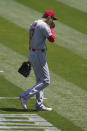 Los Angeles Angels' Shohei Ohtani (17) walks toward the dugout after being relieved during the first inning of a baseball game against the Oakland Athletics in Oakland, Calif., Sunday, July 26, 2020. (AP Photo/Jeff Chiu)