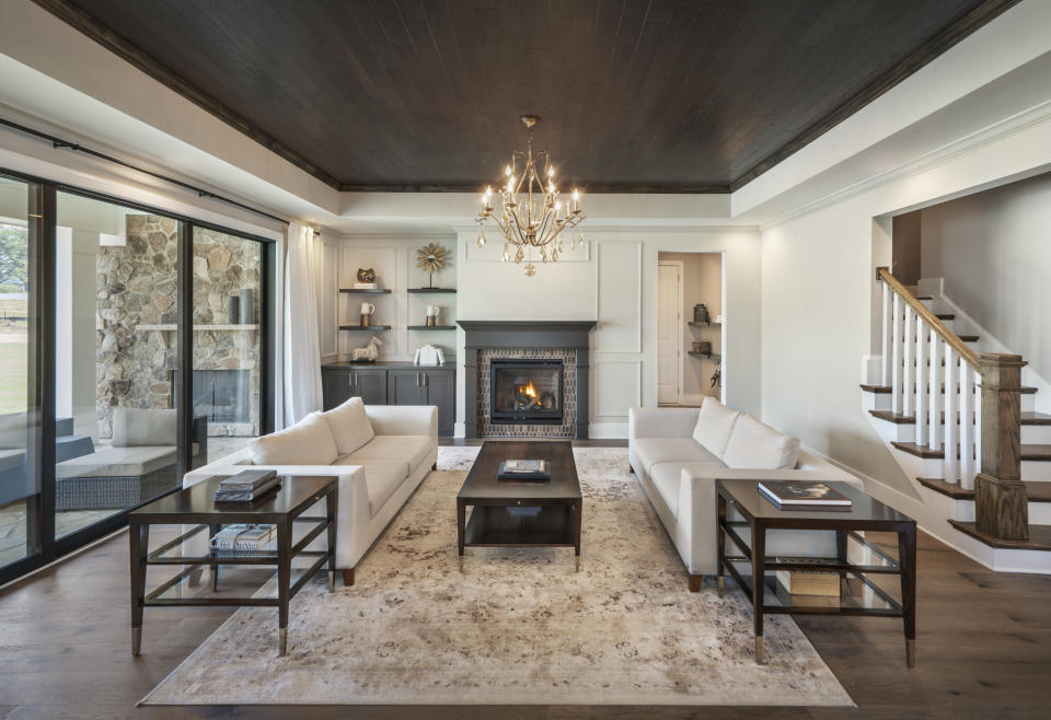 This photo provided by Ashton Woods shows a residential family room with a stained wood ceiling in the Ashton Woods Lake Castleberry community in Raleigh, N.C. (William Taylor/Taylorphoto/Ashton Woods via AP)