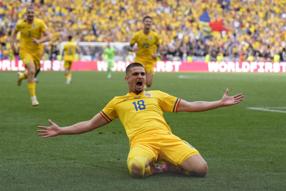 Romania's Razvan Marin celebrates scoring his side's 2nd goal during a Group E match between Romania and Ukraine at the Euro 2024 soccer tournament in Munich, Germany, Monday, June 17, 2024. (AP Photo/Antonio Calanni)