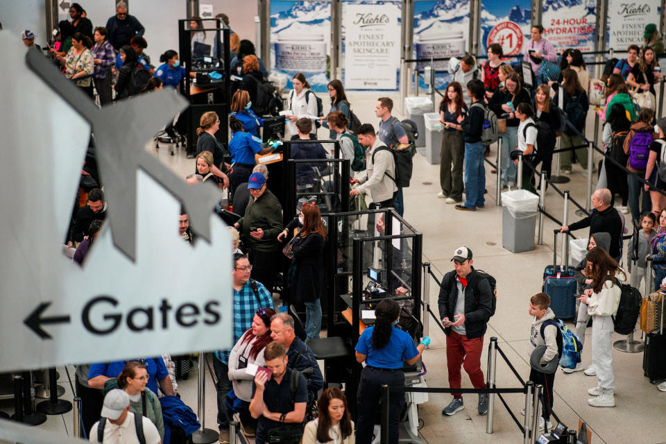 Travelers wait at John F. Kennedy International Airport in New York City, U.S., April 6, 2023. REUTERS/Eduardo Munoz