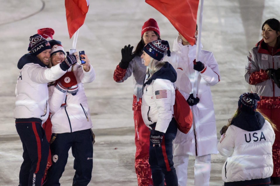 <p>Ester Ledecka of the Czech Republic, 2nd left, takes photos with U.S. athletes during the closing ceremony of the 2018 Winter Olympics in Pyeongchang, South Korea, Sunday, Feb. 25, 2018. (Jean-Christophe Bott/Keystone via AP) </p>