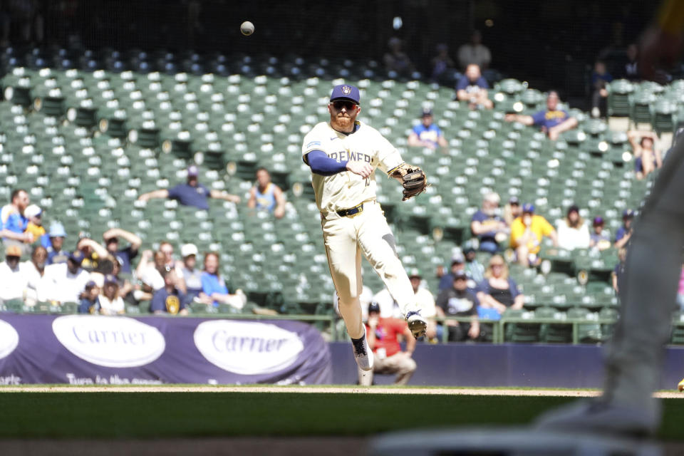 Milwaukee Brewers Oliver Dunn makes a throw to first base during the ninth inning of a baseball game against the Tampa Bay Rays, Wednesday, May 1, 2024, in Milwaukee. (AP Photo/Kenny Yoo)
