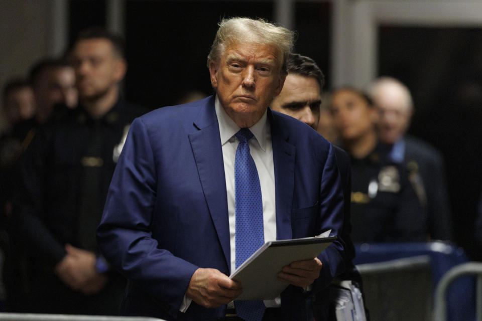 Former President Donald Trump approaches the media area to speak after attending the day's proceedings at his hush money trial, in New York, Monday, May 20, 2024. (Sarah Yenesel/Pool Photo via AP)