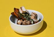 This dish featuring roasted sweet potato with collard furikake, sesame seed butter and caramelized anise spiced marshmallow is just one of numerous American culinary treats that trace their origins back to Africa