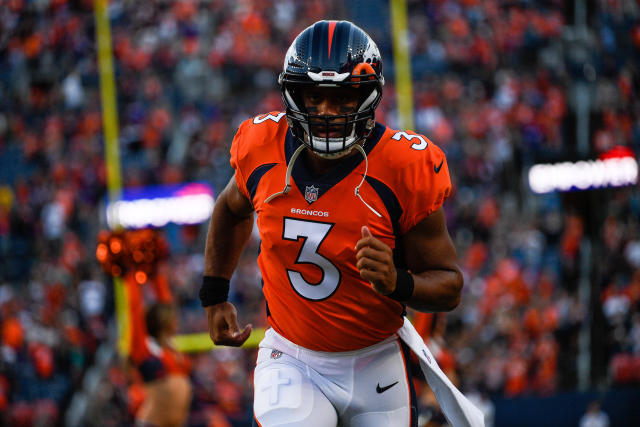DENVER, COLORADO - AUGUST 27:  Quarterback Russell Wilson #3 of the Denver Broncos runs onto the field before a preseason NFL game against the Minnesota Vikings at Empower Field at Mile High on August 27, 2022 in Denver, Colorado. (Photo by Dustin Bradford/Getty Images)