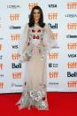 <p> This is a completely different style than we’re used to seeing Weisz in. It’s not only ultra-feminine with its light colours but the dress is also extremely bohemian thanks to the large embroidery and flowing long sleeves. Although it is an unusual look from the <em>Black Widow</em> actress, she wears it well and her blowout completes the 70s hippie-esque look. </p>