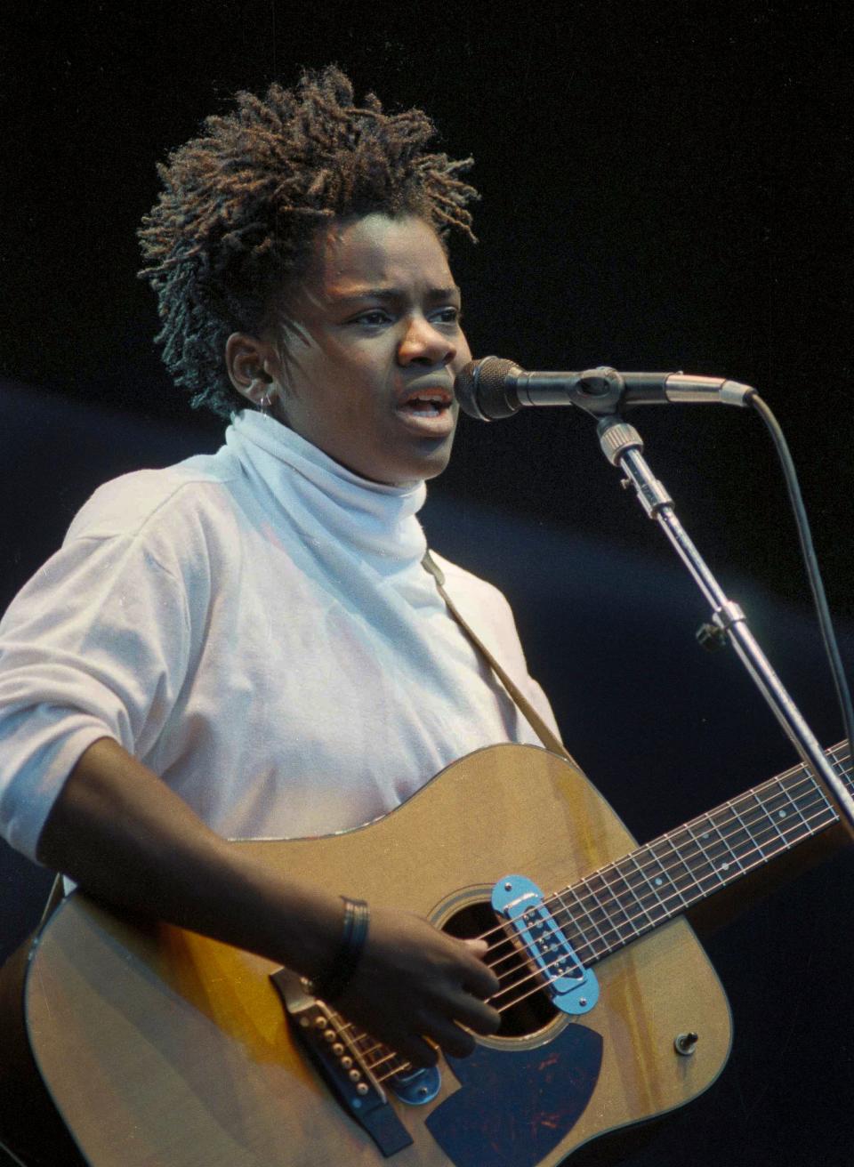 Folk singer Tracy Chapman sings at Wembley Stadium in London at a concert for human rights by Amnesty International in 1988.