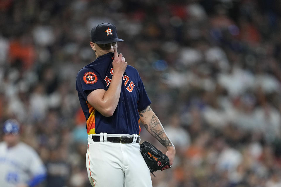 Houston Astros starting pitcher Hunter Brown wipes his face after giving up a home run to Kansas City Royals' Nelson Velazquez during the third inning of a baseball game Sunday, Sept. 24, 2023, in Houston. (AP Photo/David J. Phillip)