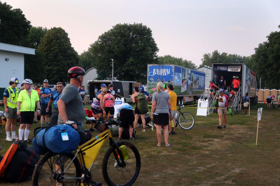 Riders load their bags on semi trailers before the first day of RAGBRAI in Le Mars on July 25, 2021.