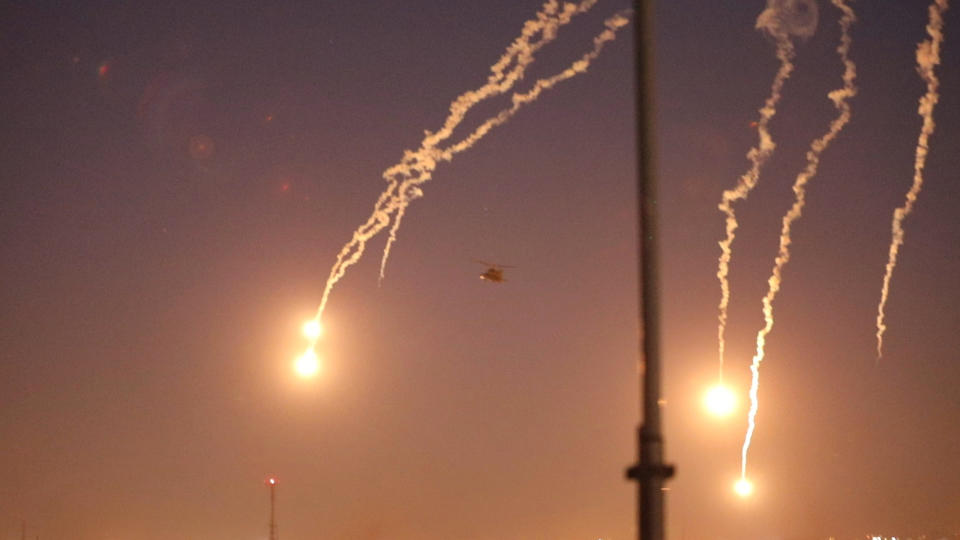 In this photo provided by the U.S. Department of Defense, the Army's AH-64 Apache helicopter from 1st Battalion, 227th Aviation Regiment, 34th Combat Aviation Brigade, conducts overflights of the U.S. Embassy in Baghdad, Iraq, Tuesday, Dec. 31, 2019. Helicopters launched flares as a show of presence while providing additional security and deterrence against protesters. (U.S. Army photo by Spc. Khalil Jenkins, CJTF-OIR Public Affairs via AP)