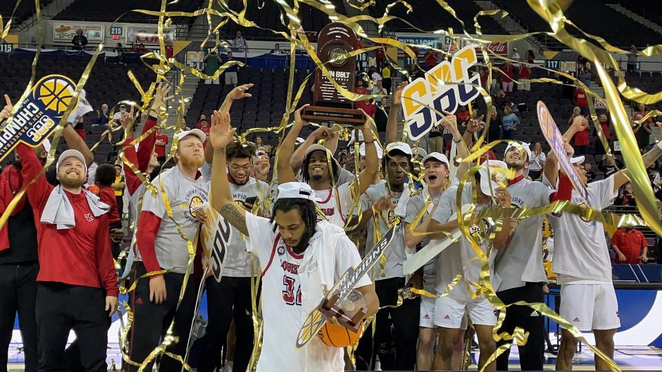 The Louisiana-Lafayette men's basketball team celebrates after capturing the Sun Belt Conference Tournament Championship following a 71-66 win over South Alabama on Monday, March 6, 2023 from the Pensacola Bay Center.