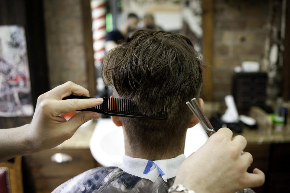 A man receiving a haircut