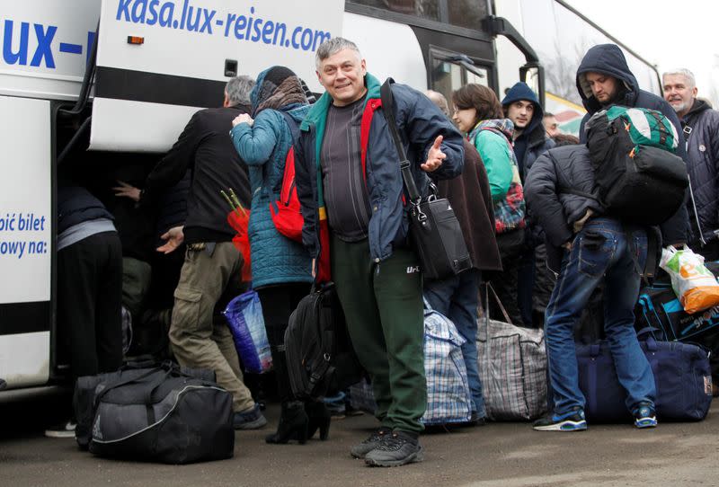 Prisoners of war get off a bus during a captives' swap between Ukraine and the separatist republics in Donetsk region