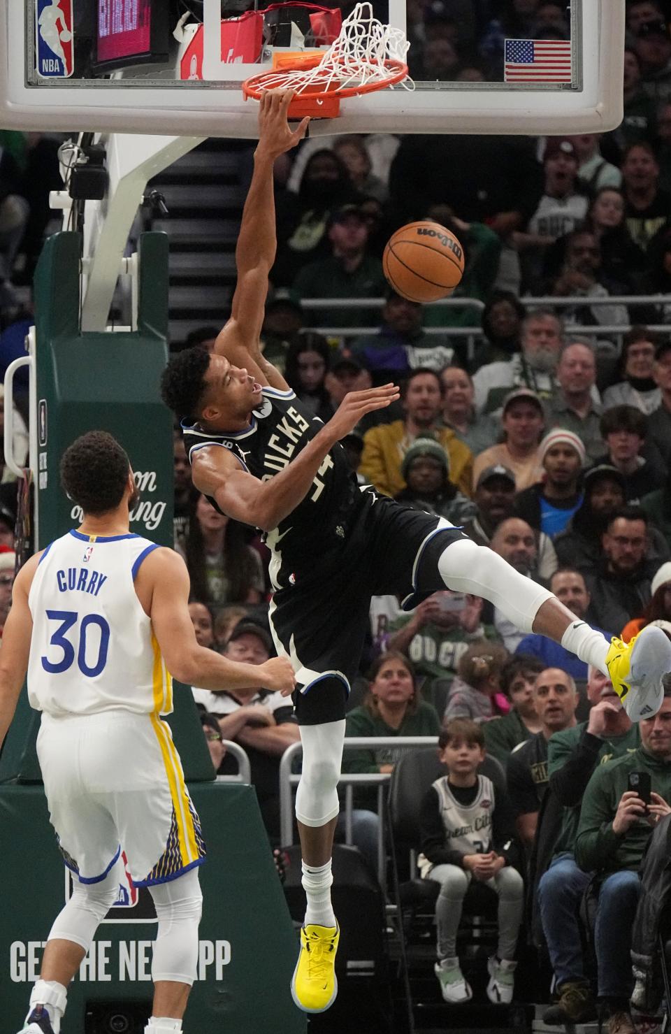 Bucks forward Giannis Antetokounmpo dunks for two of his 30 points Tuesday against the Golden State Warriors at Fiserv Forum in Milwaukee.