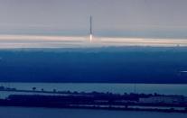 A SpaceX Falcon 9 rocket first stage returns to land at the Cape Canaveral Air Force Station in Cape Canaveral, Florida, U.S., February 19, 2017. REUTERS/Joe Skipper