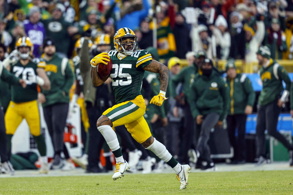 Green Bay Packers cornerback Keisean Nixon (25) runs back a kickoff for a touchdown during an NFL football game against the Minnesota Vikings Sunday, Jan. 1, 2023, in Green Bay, Wis. The NFL has pushed the kickoff return further toward irrelevance with a priority on player safety. League owners voted Tuesday, May 23, 2023, for a one-year trial of an enhanced touchback rule that will give the receiving team the ball at its own 25 with a fair catch of a kickoff anywhere behind that yard line. (AP Photo/Jeffrey Phelps)