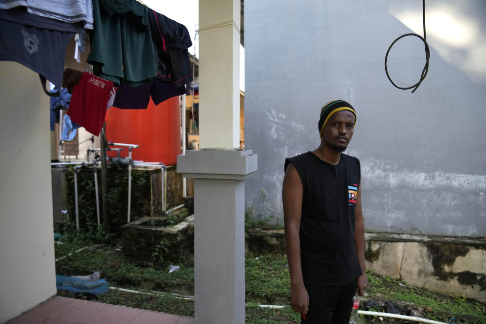 Abdulnasir, a Somalian who has spent 8 years in Indonesia, stands at a resort turned into a shelter in Tanjungpinang, Bintan Island, Indonesia, Tuesday, May 14, 2024. Many refugees had fled to the sprawling Southeast Asian archipelago as a jumping-off point hoping to eventually reach Australia by boat, but are now stuck in what feels like an endless limbo. (AP Photo/Dita Alangkara)