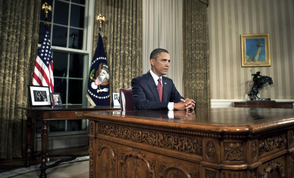 U.S. President Barack Obama sits behind his desk after addressing the nation from the Oval Office of the White House August 31, 2010 in Washington, DC. (Photo by Brendan Smialowski-Pool/Getty Images)