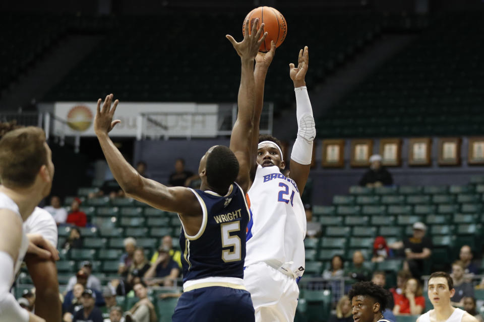 Boise State forward Abu Kigab (24) shoots over Georgia Tech forward Moses Wright (5) during the first half of an NCAA college basketball game Sunday, Dec. 22, 2019, in Honolulu. (AP Photo/Marco Garcia)