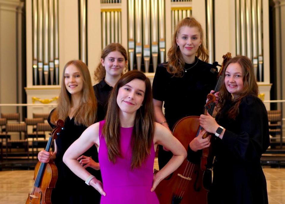 Destiny Mermagen spends some time with, from left, Hazel Ecklund-Johnson, viola; Evelyn Holmes, violin; Sarah Powers, cello; and Gabrielle Griggs, violin. Mike Mermagen./Courtesy photo