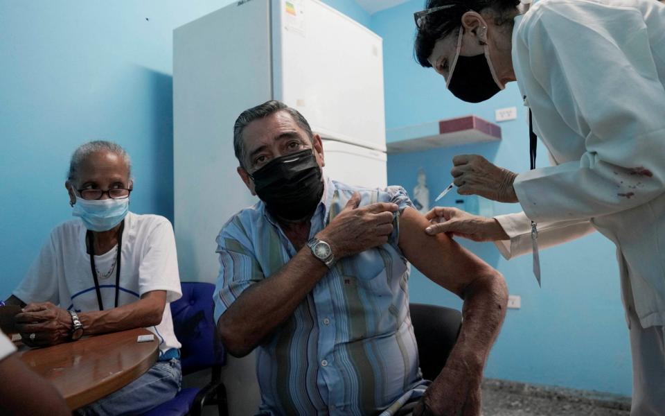 A man is vaccinated at a vaccination center amid concerns about the spread of the coronavirus disease (COVID-19) in Havana, Cuba, June 17, 2021. - Reuters