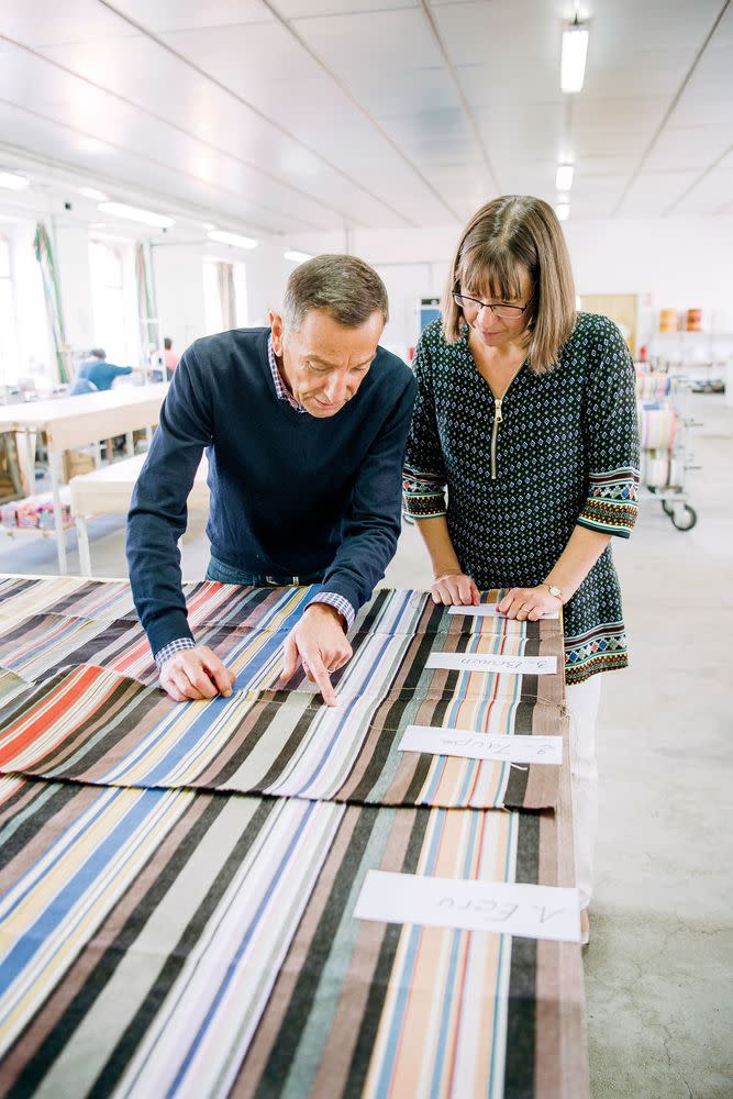 Henri examines details on a new fabric