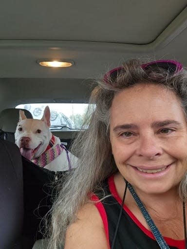 Cris Lane, a rescue volunteer from rural Georgia, drives Stanley to meet volunteers with the Cape Coral Animal Shelter