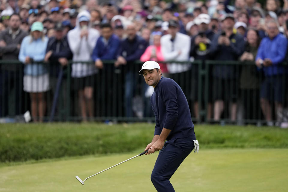 Scottie Scheffler reacts after a putt on the 18th hole during the final round of the U.S. Open golf tournament at The Country Club, Sunday, June 19, 2022, in Brookline, Mass. (AP Photo/Robert F. Bukaty)