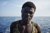 <p>19-year-old Mohammed from Ghana, who moved to Libya with his mother when he was 9-years old, poses for a photograph aboard the ‘Aqaurius’ vessel after being rescued on the Mediterranean Sea on June 25, 2016. (AP Photo/Bram Janssen) </p>