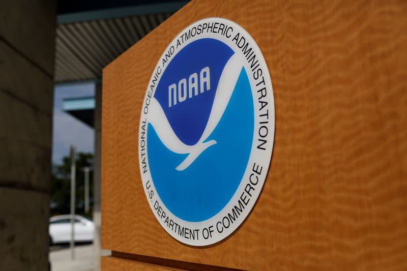 FILE PHOTO: The logo of the National Oceanic and Atmospheric Administration is seen at the National Hurricane Center in Miami