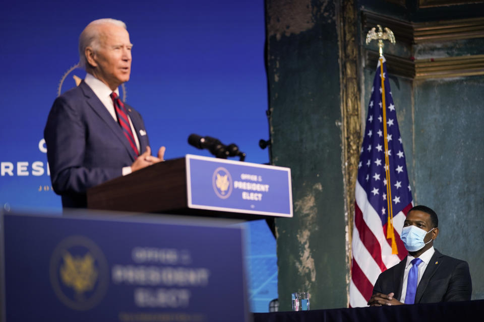 Michael Regan listens as President-elect Joe Biden announces him as his nominee for EPA Administrator at The Queen Theater in Wilmington Del., Saturday, Dec. 19, 2020. (AP Photo/Carolyn Kaster)