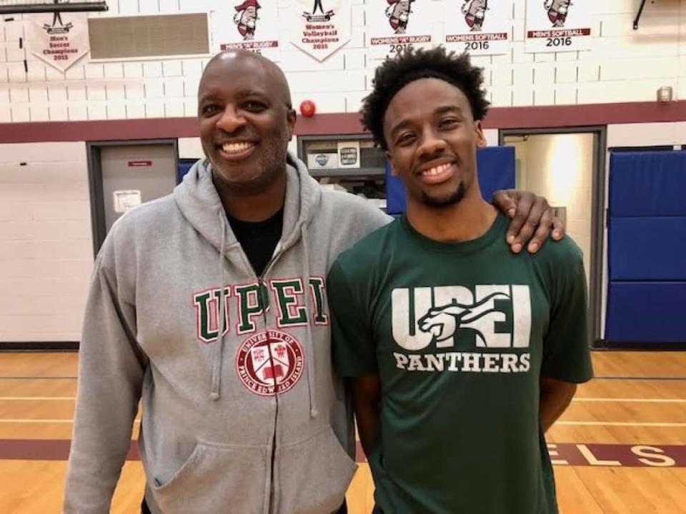 UPEI men's basketball head coach Darrell Glenn and AUS MVP and first-team all-star Elijah Miller. (Sarah Keaveny Vos/CBC - image credit)