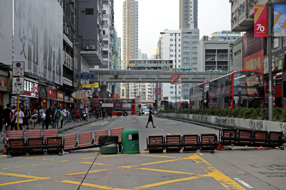 Barriers are set by protesters on a road during a protest in Hong Kong, Saturday, Oct. 12, 2019. The protests that started in June over a now-shelved extradition bill have since snowballed into an anti-China campaign amid anger over what many view as Beijing's interference in Hong Kong's autonomy that was granted when the former British colony returned to Chinese rule in 1997. (AP Photo/Kin Cheung)