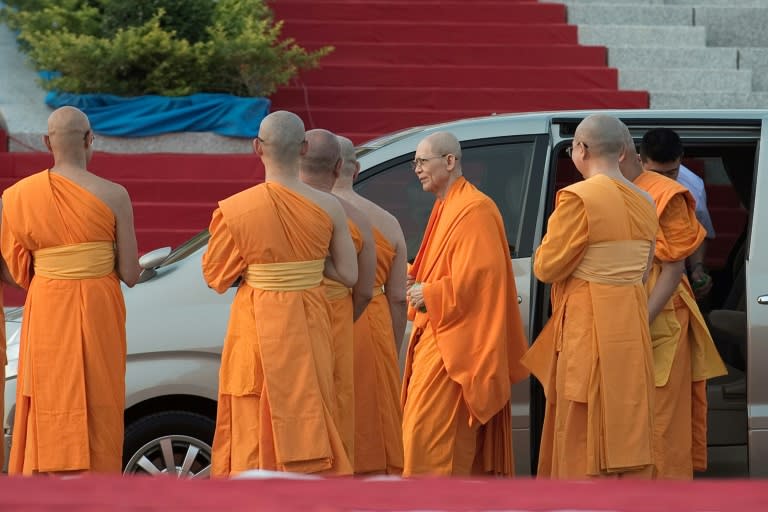 Phra Dhammachayo (C), abbot of the Dhammakaya Temple and founder of the Dhammakaya Foundation, seen with other monks at the temple north of Bangkok in 2015