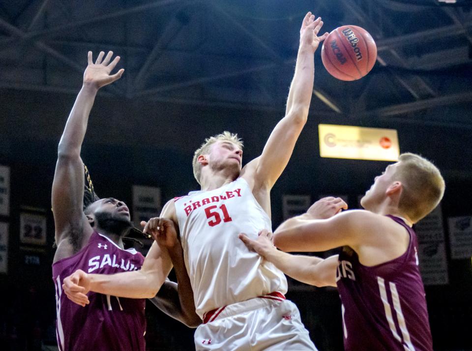 Bradley's Rienk Mast (51) battles for a rebound with the Southern Illinois defense in the first half Saturday, Jan. 22, 2022 at Carver Arena. The Braves defeated the Salukis 70-62.