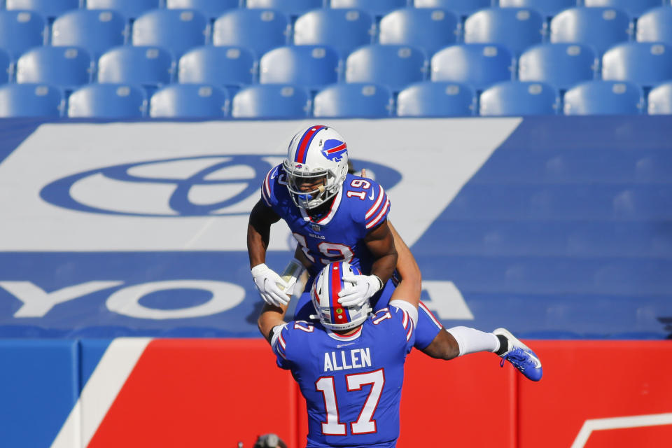 Buffalo Bills quarterback Josh Allen (17) celebrates with teammate Isaiah McKenzie after they connected for a touchdown during the first half of an NFL football game against the Seattle Seahawks Sunday, Nov. 8, 2020, in Orchard Park, N.Y. (AP Photo/Jeffrey T. Barnes)