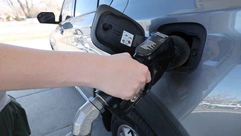 A car is filled at a gas pump in Sandy on Tuesday, March 19, 2024. Prices are trending higher in Utah.