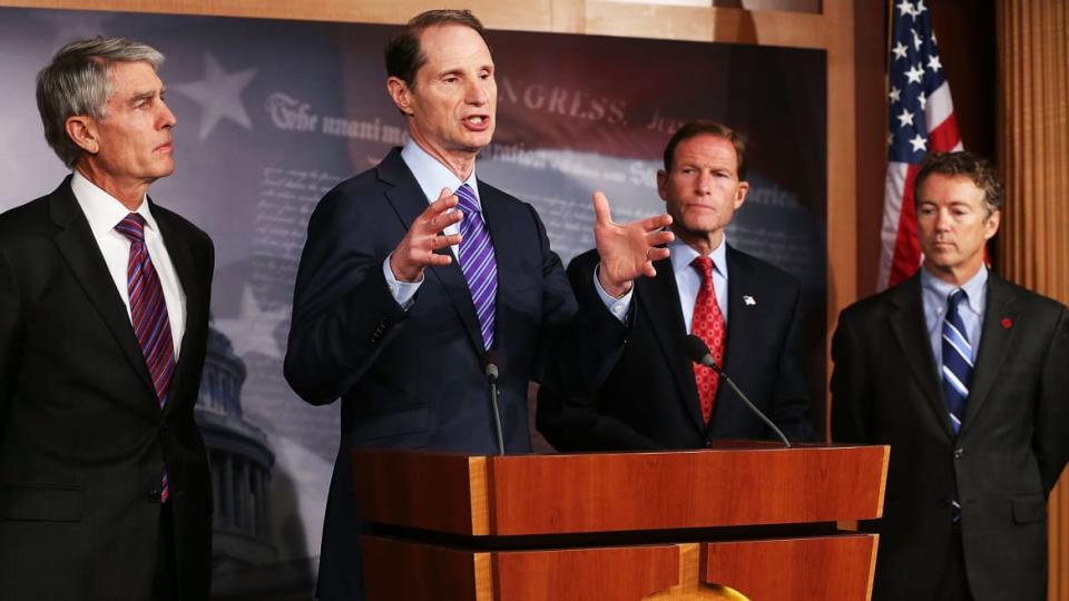 A photo including U.S Sen. Ron Wyden, Sen. Mark Udall, Sen. Richard Blumenthal, Sen. Rand Paul, in Capitol Hill in Washington, DC.