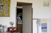Rabbi Barbara Aiello,celebrates a Bat Mitvah ceremony in the "Ner Tamid del Sud" (The Eternal Light of the South) synagogue, in Serrastretta, southern Italy, Friday, July 8, 2022. From a rustic, tiny synagogue she fashioned from her family's ancestral home in this mountain village, American rabbi Aiello is keeping a promise made to her Italian-born father: to reconnect people in this southern region of Calabria to their Jewish roots, links nearly severed five centuries ago when the Inquisition forced Jews to convert to Christianity. (AP Photo/Andrew Medichini)