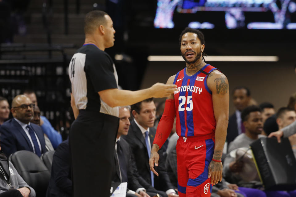 Detroit Pistons guard Derrick Rose, right, questions referee Curtis Blair, left, about a foul call during the first half of an NBA basketball game against the Sacramento Kings in Sacramento, Calif., Sunday, March 1, 2020. (AP Photo/Rich Pedroncelli)