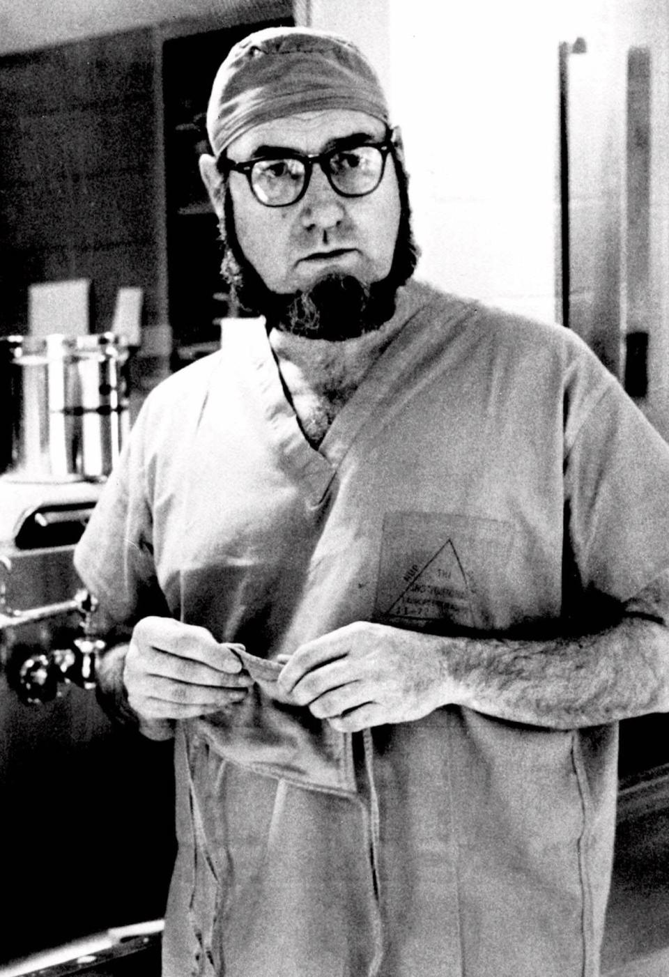 Dr. C. Everett Koop, surgeon-in-chief at Children's Hospital in Philadelphia, talks about surgery that separated 13-month-old siamese twins, Clara and Alta Rodriguez, Sept. 19, 1974. (AP Photo/William Ingram)