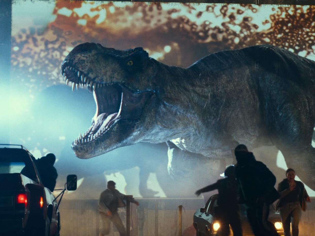 A dinosaur roars in a scene from Jurassic World: Dominion