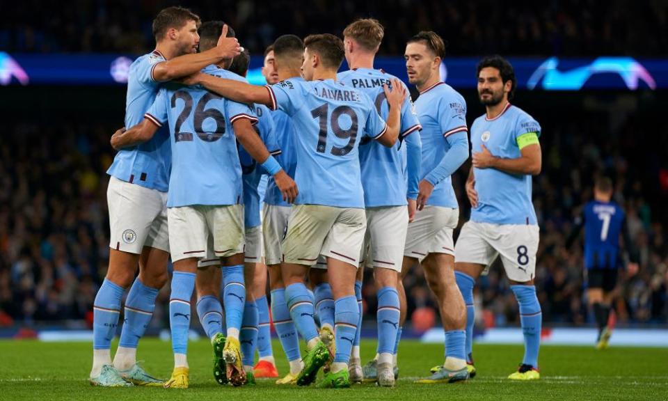 Riyad Mahrez of Manchester City celebrates with teammates after scoring his team’s fourth goal.