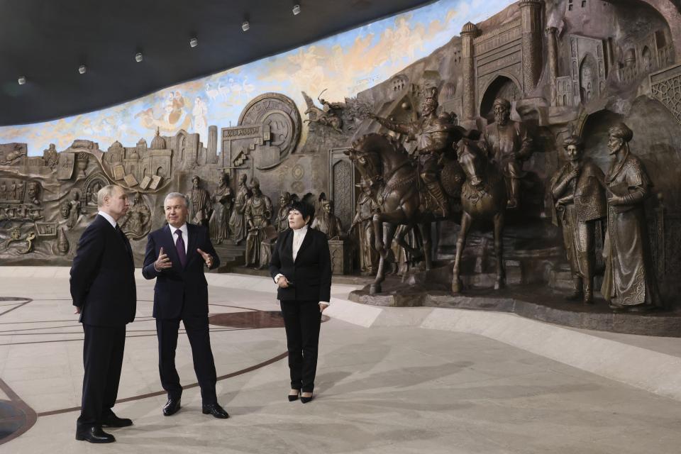 Russian President Vladimir Putin, left, and Uzbek President Shavkat Mirziyoyev visit Yangi O'zbekiston park during their meeting in Tashkent, Uzbekistan, Sunday, May 26, 2024. (Mikhail Metzel, Sputnik, Kremlin Pool Photo via AP)