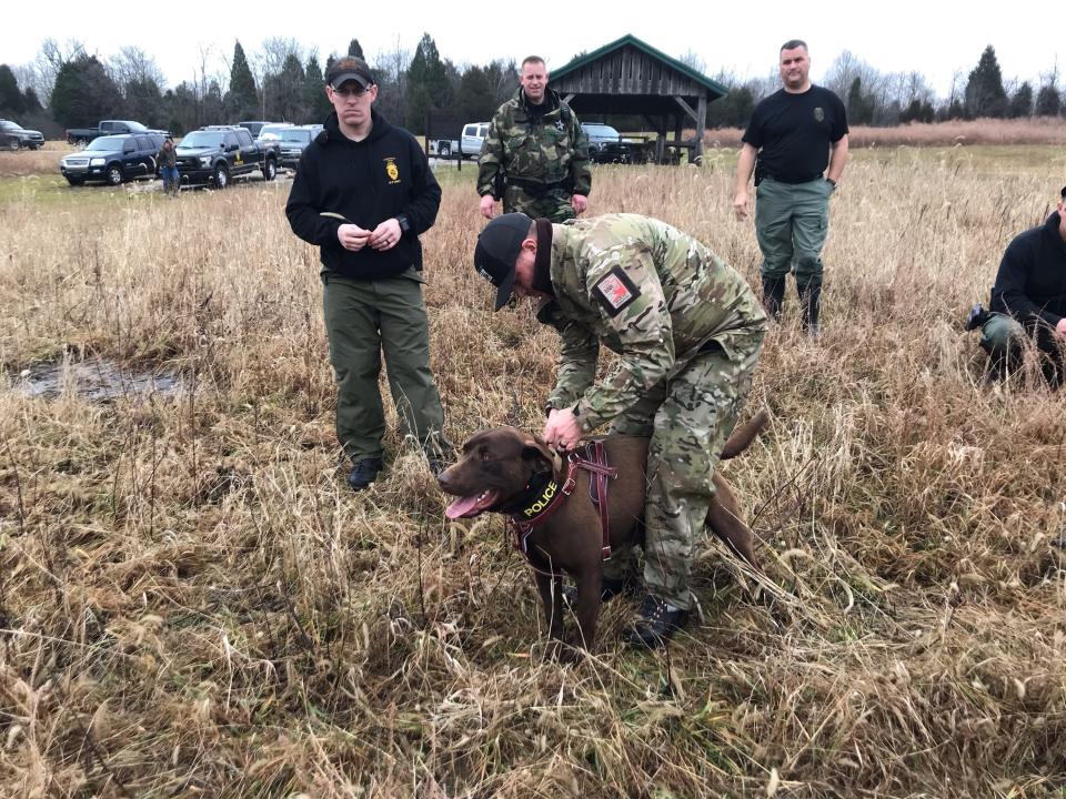 A Utah DWR officer undergoes K9 training with his dog.