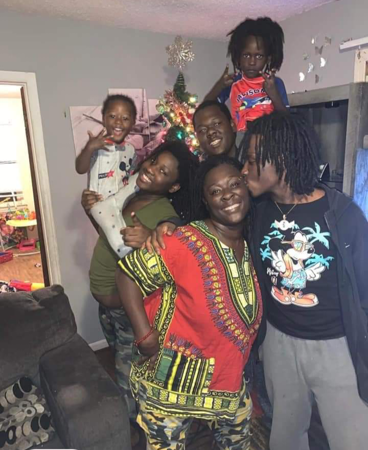 Brittany Martin (middle) poses with five of her children in 2021. Her son, Courtney Harris, 18, (right, kissing Harris) was murdered in Waterloo, Iowa, on Jan. 8, 2022. (Courtesy of Eric Kennedy)